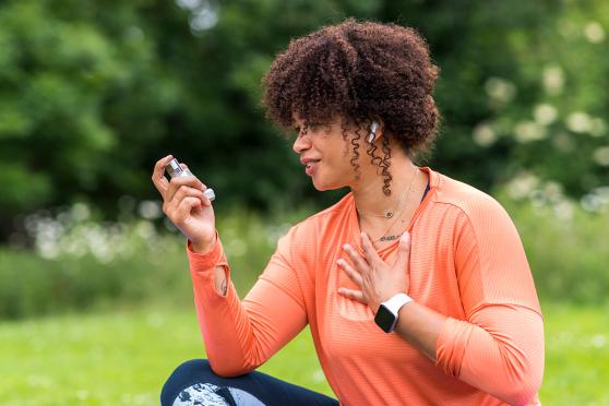 Woman using inhaler